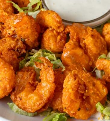 12 Golden fried shrimp tossed in your choice of sauce.